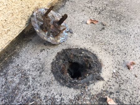 A rusted and corroded roof drain in San Luis Obispo